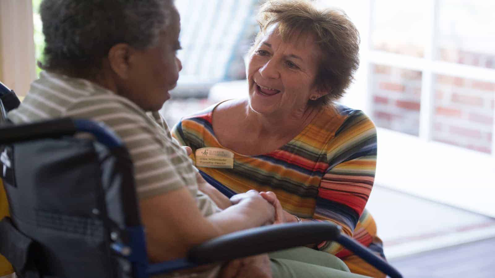 Staff member talking with resident