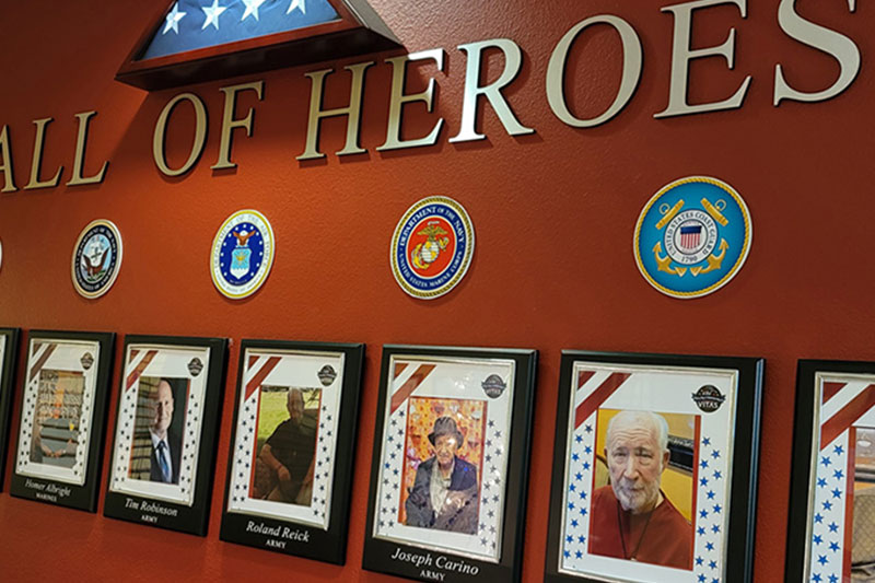 Wall of heros honoring residents that are veterans